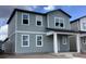 Two-story gray home with multiple windows and covered front porch at 2342 Broadbrook Drive, St Cloud, FL 34771