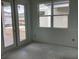 Unfinished interior view with a window and glass patio door at 2342 Broadbrook Drive, St Cloud, FL 34771
