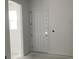 Interior view of a room with a white door and window at 2342 Broadbrook Drive, St Cloud, FL 34771