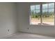 Room interior with large window offering outdoor views and ample natural light at 2342 Broadbrook Drive, St Cloud, FL 34771