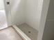 New bathroom shower with gray tiling and sleek fixtures at 2342 Broadbrook Drive, St Cloud, FL 34771