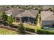 Aerial view of the property, showcasing the screened lanai, fenced backyard and landscaping at 2530 Stargrass Cir, Clermont, FL 34715