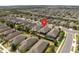 Aerial view of the neighborhood with the house identified by a red marker pin at 2530 Stargrass Cir, Clermont, FL 34715