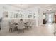 Elegant dining area with a chandelier, paneled walls, and seating for six at 2530 Stargrass Cir, Clermont, FL 34715