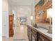 Elegant foyer featuring tile flooring, high ceilings, decorative art, and an open view of the living spaces at 2530 Stargrass Cir, Clermont, FL 34715