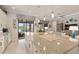 Spacious kitchen island offers seating and complements the home's open layout and access to outdoor living at 2530 Stargrass Cir, Clermont, FL 34715