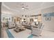 Spacious living room with an open floor plan connecting to the kitchen and dining area at 2530 Stargrass Cir, Clermont, FL 34715