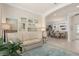 Cozy living room with an open layout, leading to the dining area and featuring neutral color schemes at 2530 Stargrass Cir, Clermont, FL 34715