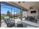 Relaxing screened patio with comfortable seating, dining area, and beautiful backyard views at 2530 Stargrass Cir, Clermont, FL 34715