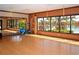 Community yoga studio features hardwood floors, full wall mirror, and pool view at 2530 Stargrass Cir, Clermont, FL 34715