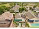Charming neighborhood aerial view showcases manicured lawns, mature trees, gazebo, and solar panels on the roof at 2626 Clarinet Dr, Orlando, FL 32837