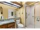Bathroom featuring a glass shower, granite vanity, and wood cabinets at 2626 Clarinet Dr, Orlando, FL 32837