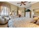 Comfortable bedroom with large bed, dresser, chair, and TV at 2626 Clarinet Dr, Orlando, FL 32837