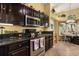 Well-equipped kitchen featuring dark cabinets, stainless steel appliances and a tiled backsplash at 2626 Clarinet Dr, Orlando, FL 32837