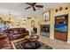 Bright living room featuring tile floors, a fireplace, and comfortable seating at 2626 Clarinet Dr, Orlando, FL 32837