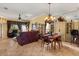 Open-concept living room features tile floors, a ceiling fan, and sliding doors to the lanai at 2626 Clarinet Dr, Orlando, FL 32837
