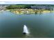 Aerial view of the neighborhood clubhouse, pool, and fountain in the lake at 2638 Giardino Loop, Kissimmee, FL 34741