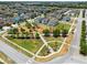 Aerial view of the neighborhood, showcasing a green space and landscaping at 2638 Giardino Loop, Kissimmee, FL 34741