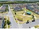 Aerial view of the neighborhood park with a covered gazebo and playground area at 2638 Giardino Loop, Kissimmee, FL 34741