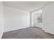 Neutral bedroom with gray carpet, one window, and a built-in shelving nook at 2638 Giardino Loop, Kissimmee, FL 34741