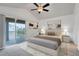 Inviting main bedroom with vaulted ceiling and private balcony access at 2638 Giardino Loop, Kissimmee, FL 34741