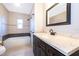 Stylish bathroom with a dark wood vanity and modern fixtures at 3024 Sutton Dr, Orlando, FL 32810