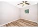 Neutral bedroom with wood laminate flooring and bright window at 3024 Sutton Dr, Orlando, FL 32810