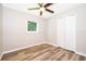 Bedroom with laminate flooring and a double door closet at 3024 Sutton Dr, Orlando, FL 32810