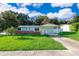 Charming single-story home with a well-maintained lawn and carport at 3024 Sutton Dr, Orlando, FL 32810