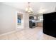 Cozy kitchen with tile floors and access to the back yard at 3024 Sutton Dr, Orlando, FL 32810