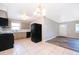 Bright kitchen with black appliances and tile floors at 3024 Sutton Dr, Orlando, FL 32810