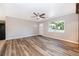 Inviting living room filled with natural light and new wood floors at 3024 Sutton Dr, Orlando, FL 32810