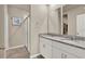Bathroom featuring a shower, double vanity, and granite countertop at 30276 Armenia Rd, Leesburg, FL 34748