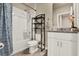 Modern bathroom featuring a shower-tub combination, vanity, and tile flooring at 30276 Armenia Rd, Leesburg, FL 34748