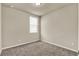 Cozy bedroom features a neutral color scheme, carpet and natural light from the window at 30276 Armenia Rd, Leesburg, FL 34748