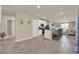 Open kitchen featuring an island with bar seating, white cabinets, and modern appliances at 30276 Armenia Rd, Leesburg, FL 34748