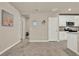 Open floor plan, showing the kitchen and adjoining empty dining or living space at 30276 Armenia Rd, Leesburg, FL 34748