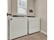 Functional laundry room with a washer and dryer, offering convenience and efficiency at 30276 Armenia Rd, Leesburg, FL 34748