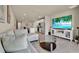 Bright and airy living room with an open floor plan, connecting to the kitchen at 30276 Armenia Rd, Leesburg, FL 34748