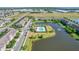 The aerial shows the community pool by the lake and townhomes at 335 Merry Brook Cir, Sanford, FL 32771