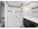 Bathroom with a glass shower door, neutral tones, and modern fixtures at 335 Merry Brook Cir, Sanford, FL 32771