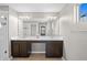 Bathroom features a double vanity, large mirror, modern lighting, and tiled flooring at 335 Merry Brook Cir, Sanford, FL 32771