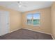 Comfortable bedroom with a neutral color palette and a large window offering outdoor views at 335 Merry Brook Cir, Sanford, FL 32771