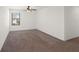Spacious bedroom featuring neutral walls, carpeted floor, and a sunny window with blinds at 335 Merry Brook Cir, Sanford, FL 32771
