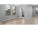 Bright dining room with tile flooring, large windows, and a stylish chandelier at 335 Merry Brook Cir, Sanford, FL 32771