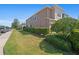 Exterior side view of a two-story house with green landscaping and sidewalk at 335 Merry Brook Cir, Sanford, FL 32771