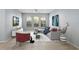 Bright living room with neutral paint, ceiling fan, modern furnishings, and three sunny windows at 335 Merry Brook Cir, Sanford, FL 32771