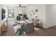 Cozy living room featuring a comfortable sofa, stylish decor, and a modern ceiling fan at 335 Merry Brook Cir, Sanford, FL 32771