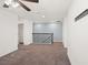 Open loft area with neutral walls, carpeted floors, and a staircase with black iron spindles, offering flexible living space at 335 Merry Brook Cir, Sanford, FL 32771
