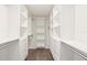 Custom walk-in closet with ample shelving, drawers, and hanging space for organized storage at 335 Merry Brook Cir, Sanford, FL 32771